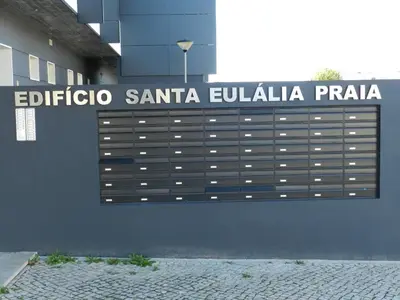 a sign on the side of a building at Casa Sensa in Albufeira