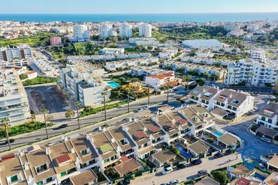 an aerial view of a city with buildings at L14 by MTPhomes in Vale de Pedras