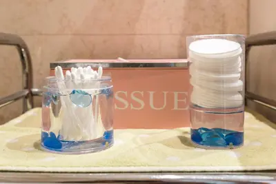a table with a container of toothbrushes on a table at Beachfront flat, private parking, pools, sea at less than 200 m in Albufeira