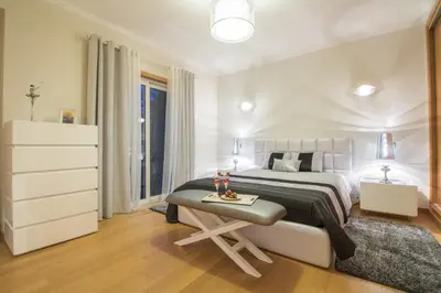 a bedroom with two beds and a lamp in it at Villa Mar in Almancil