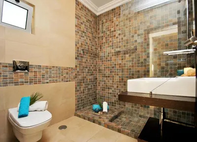 a bathroom with a toilet and a sink at Villa Buddha by Algarve Vacation in Albufeira