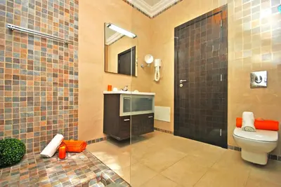 a bathroom with a toilet and a sink and a mirror at Villa Buddha by Algarve Vacation in Albufeira
