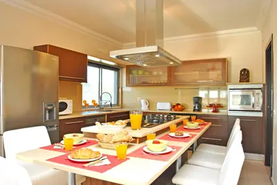 a kitchen with a table with food on it at Villa Buddha by Algarve Vacation in Albufeira