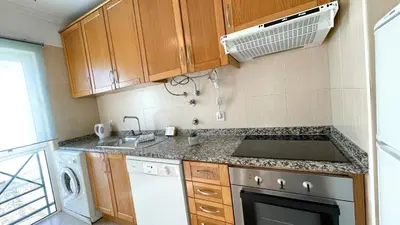 a small kitchen with a stove and a dishwasher at Oura Lancemar by Sunny Deluxe in Albufeira