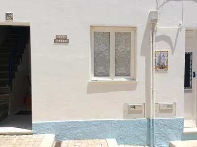 a white building with a window on the side of it at Casa Alzira By ALzira in Albufeira
