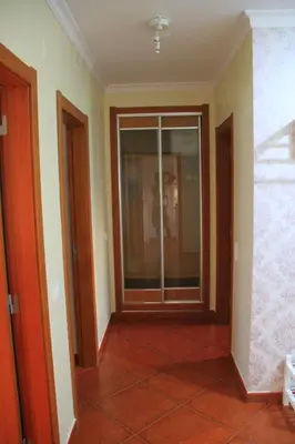 an empty hallway with a glass door in a house at MSHomes Corcovada in Albufeira