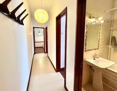 a bathroom with a sink and a mirror at Casa Marum in Faro