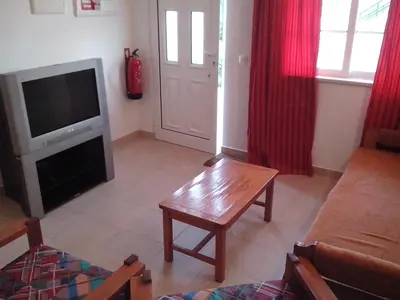 a living room with a television and a coffee table at Apartment with 2 Bedrooms B in Albufeira