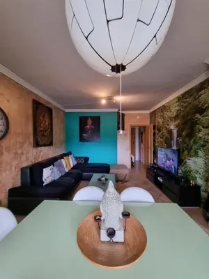 a living room with a table with a cow head on it at T1 Falesia in Albufeira