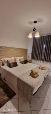 a bedroom with two beds with towels on them at Tulipa Férias (29506) in Vilamoura
