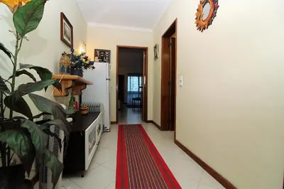 a hallway with a red rug on the floor at Belavista Centre - Albufeira in Albufeira