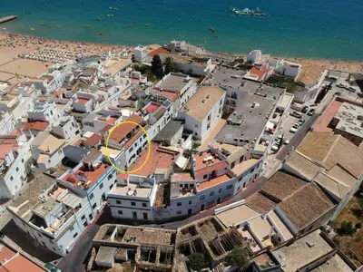 an aerial view of a city with a beach at Fisherman's Townhouse at Old Town in Albufeira