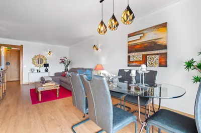 a living room with a couch and a table at Penthouse Sea View by Albufeira Holidays in Albufeira