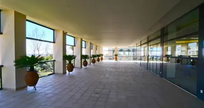 a gym with several exercise bikes and a television at Crowne Plaza Vilamoura - Algarve by IHG in Vilamoura