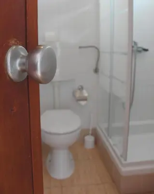 a roll of toilet paper sitting on top of a sink at Vegas Residence - Adults Only in Albufeira