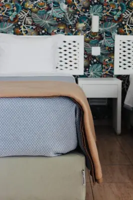 a room with two beds and a lamp at Vegas Residence - Adults Only in Albufeira