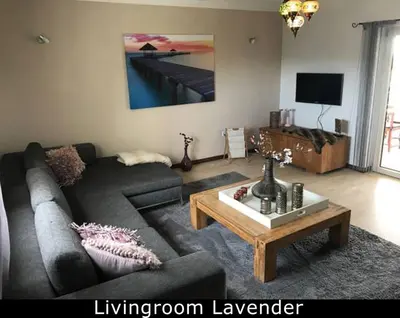 a living room with a couch and a coffee table at Cegonha Villa powered by Cegonha Resort- Private swimming pool & air con in Albufeira