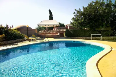 a large swimming pool in a yard at Lageado Park in Albufeira