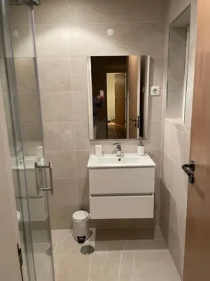 a bathroom with a sink and a mirror at Boa Vida in Quarteira