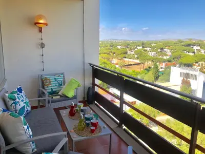 a balcony with a table and a view of a city at Romantic Studio By Ethnic Ocean in Vilamoura