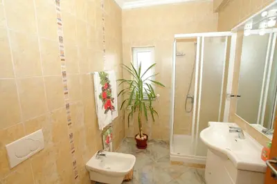 a bathroom with a sink and a toilet and a shower at Vivenda Luz - Jacuzzi & Swimming Pool in Albufeira