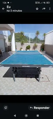 a ping pong table sitting on top of a patio at Vivenda Luz - Jacuzzi & Swimming Pool in Albufeira