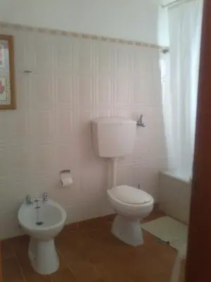 a bathroom with a toilet and a bidet at Casa da Guida in Albufeira