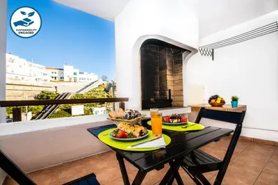 a dining room with a table with food on it at Apartment Marbella by Algarve Vacation in Albufeira