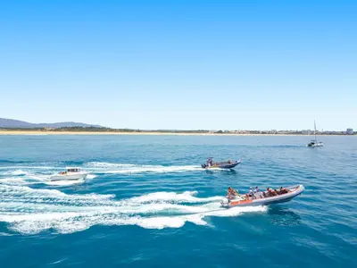 a group of people in boats in the water at Apartment Marbella by Algarve Vacation in Albufeira