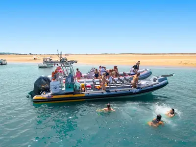 a group of people on a boat in the water at Apartment Marbella by Algarve Vacation in Albufeira