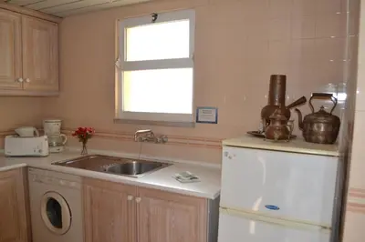 a kitchen with a sink and a refrigerator at TP MARINA 27, Vilamoura View Apartment in Quarteira