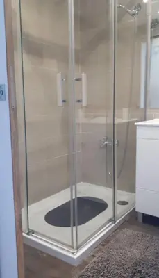 a shower with a glass door in a bathroom at Hello Sun in Vilamoura