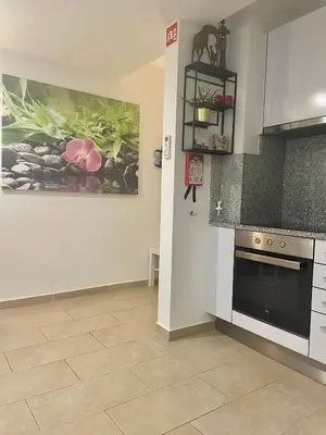 a kitchen with a sink and a stove top oven at Bayview Apartment 213 in Albufeira