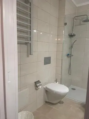 a bathroom with a toilet and a shower at Bayview Apartment 213 in Albufeira