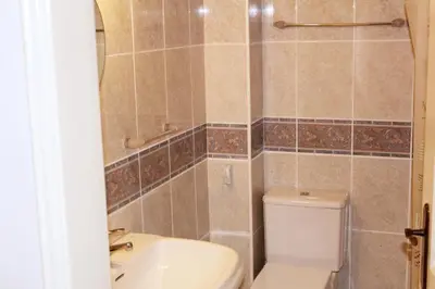 a bathroom with a toilet and a sink at Wonderful Villa in Albufeira
