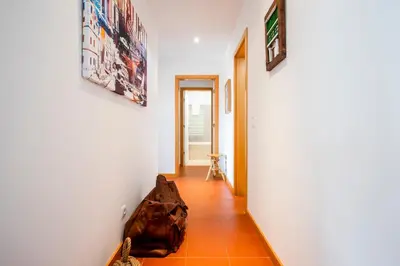 a hallway with a bag sitting on the floor at Golf Residence Apartment in Vilamoura