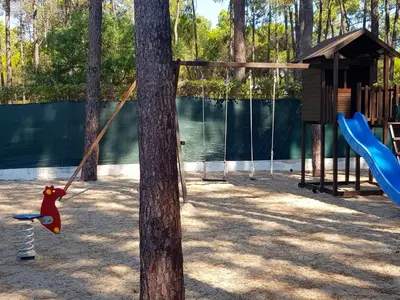 a playground with a monkey swing on a tree at Nautilus 135- Clever Details in Vilamoura