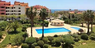 an aerial view of a resort with a swimming pool at Albufeira Centrally Located Apartment with Pool View in Albufeira