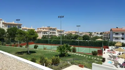 a tennis court in the middle of a city at Vista das Ondas Apartment in Albufeira