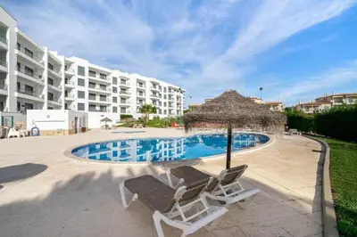 a view of a swimming pool in a resort at Vista das Ondas Apartment in Albufeira