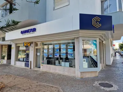 a store front of a building with a sign on it at Torres Mira Praia by Garvetur in Quarteira