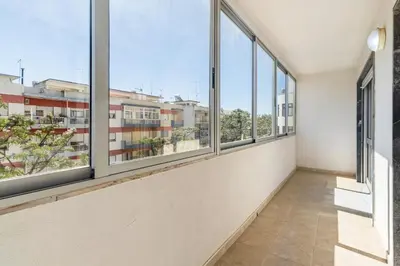 an empty room with windows in a building at Paula Bela by Garvetur in Quarteira