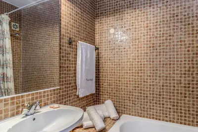 a bathroom with a sink and a mirror at FLH Vilamoura Cozy Studio in Vilamoura