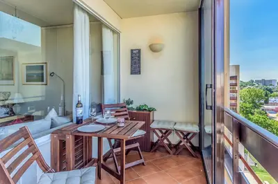 a patio with a table and chairs on a balcony at FLH Vilamoura Cozy Studio in Vilamoura