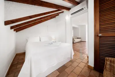 a bedroom with a white bed in a room at AL - Apartamento Vista Marina 2 in Vilamoura