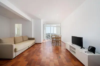 a living room with a couch and a television at AL - Apartamento Vista Marina 2 in Vilamoura