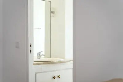a bathroom with a sink and a mirror at AL - Apartamento Vista Marina 2 in Vilamoura