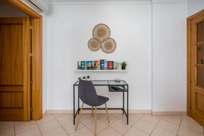 a desk with a chair in a room at #001 Veríssimo Flat by Home Holidays in Albufeira