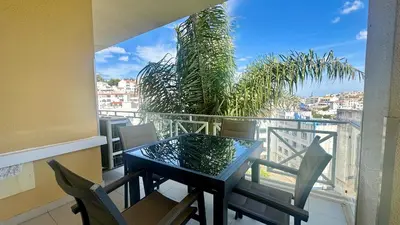 a dining room with a white table and chairs at Garden Hill M by Check-in Portugal in Albufeira