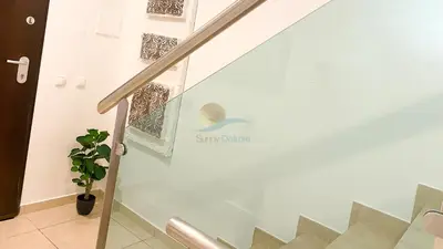 a staircase with a sign on the side of a glass wall at Villa Jardins 2 by Sunny Deluxe in Albufeira